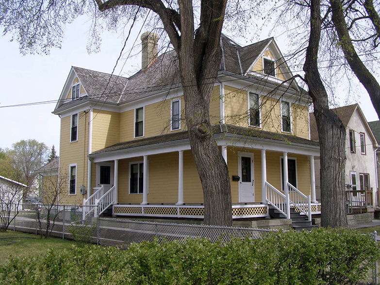 the old The yellow house called Maison Gabrielle Roy on a bright sunny day 