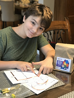 A student is pictured doing school work